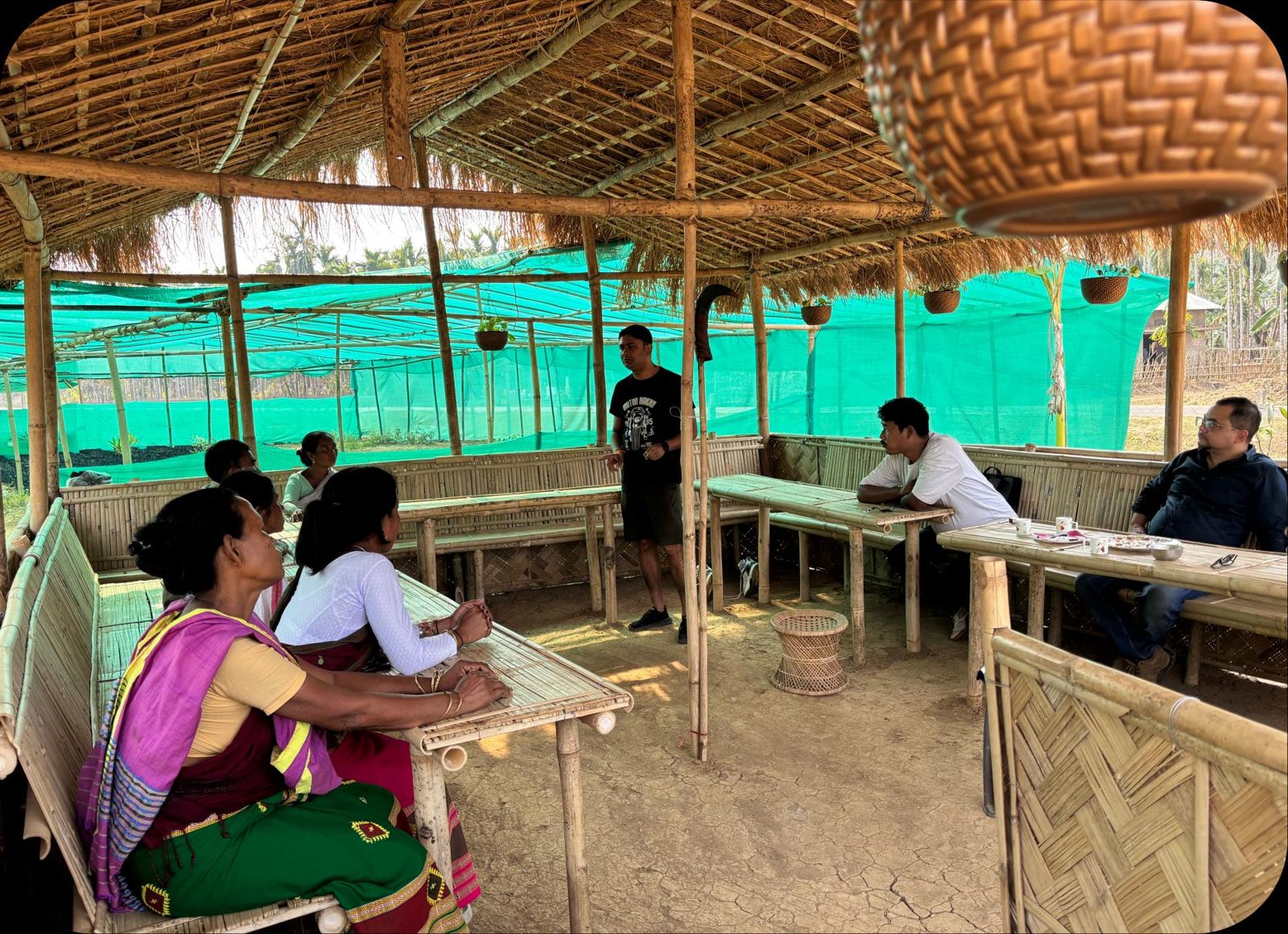 Session in progress inside the bamboo farm hut